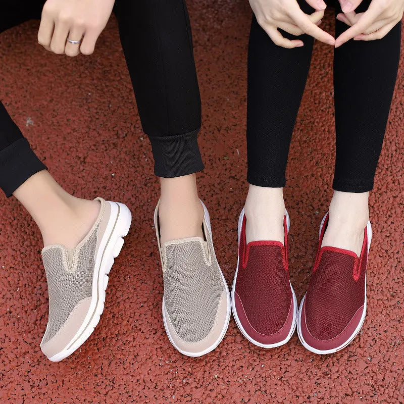 Women's light grey mesh toe holder slippers with a flat sole on a white background.