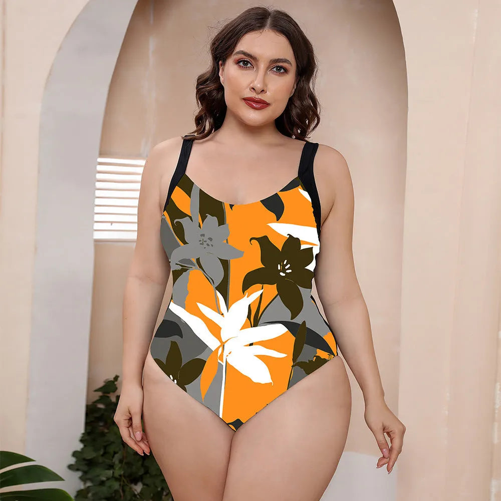 Conservative one-piece vest swimsuit with spaghetti straps and a vibrant floral print.