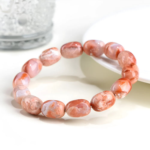 Original design agate bracelet with cherry blossom colour barrel beads and Ruyi charm.