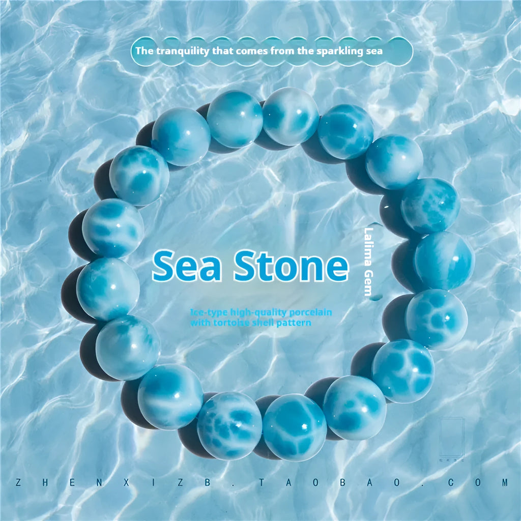 Blue Maillard style bodhi bracelet with natural crystal, sea-pattern stone, and pearls on a white background.