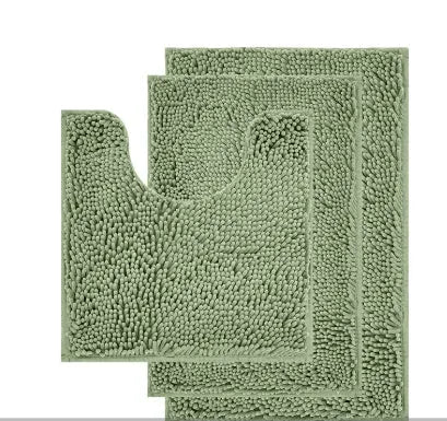 Dark green chenille U-shaped three-piece bathroom toilet carpet set on tiled floor.