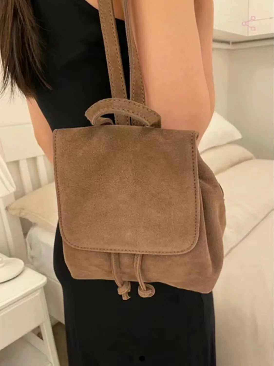 Retro suede girls backpack in brown with shoulder strap and sewing thread detailing