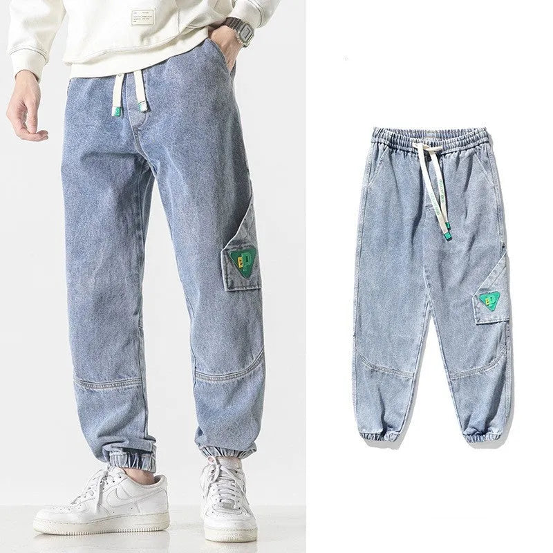 Men's loose-fit tapered cotton trousers in black, blue, and grey colours showing mid-waist design
