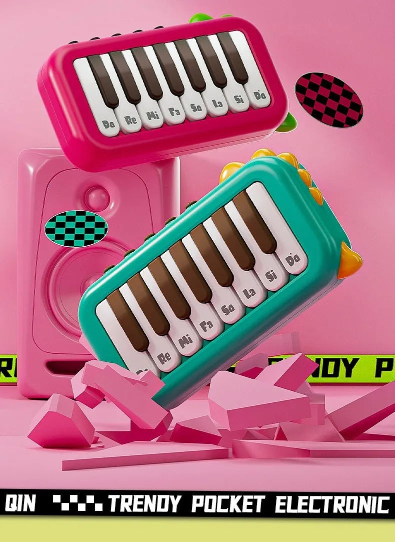 Pocket electronic keyboard toy for children in green or pink, plays little piano patterns for developmental training.