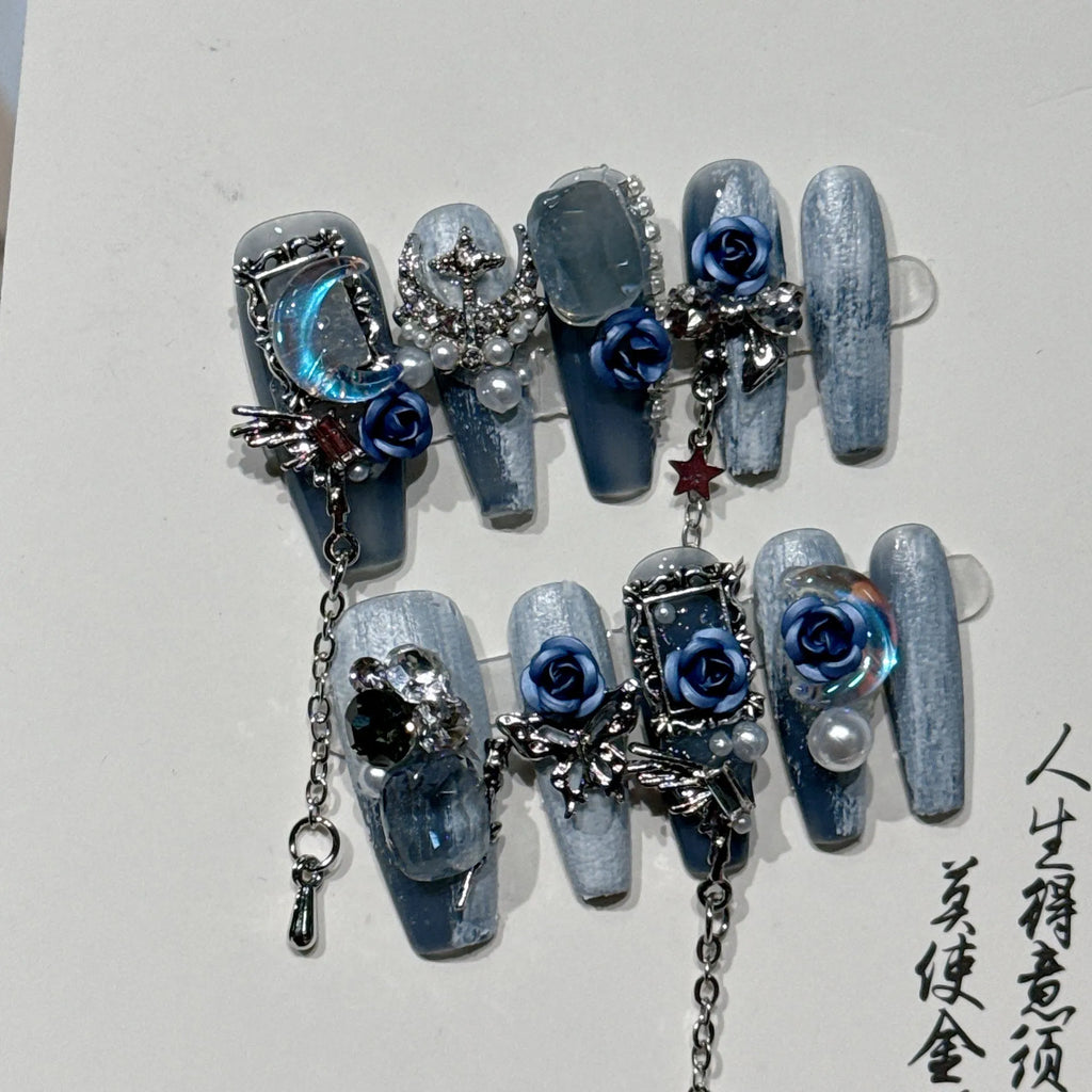Blue false nails with rose and flower pattern, shown in a set with sizes XS, S, M, L.