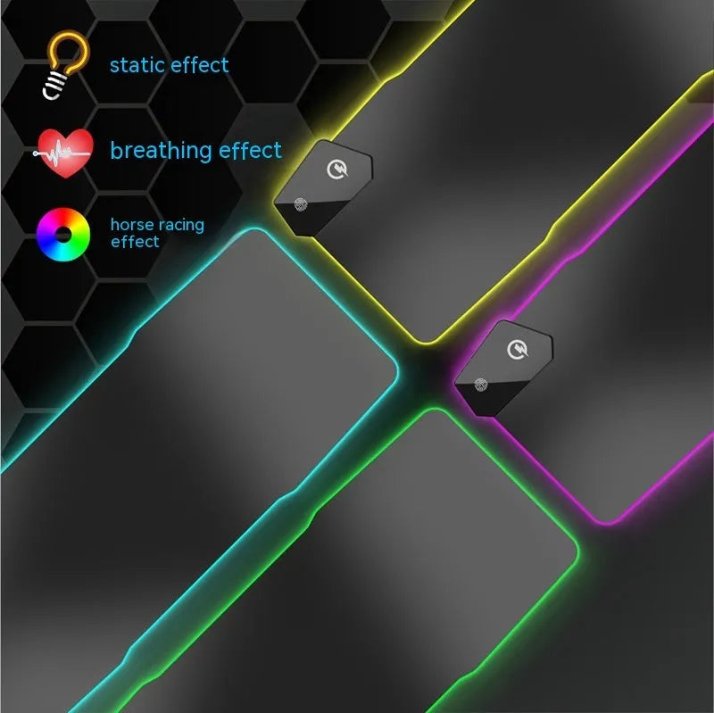 Large black gaming mouse pad with luminous edge lighting on a desk.