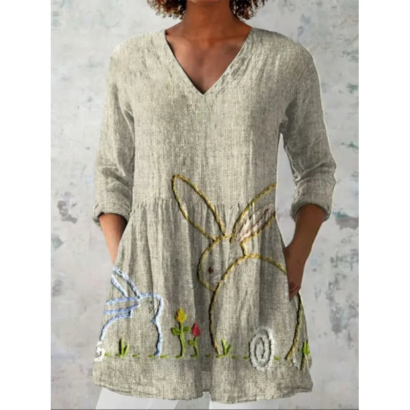 Women's loose-fitting long dress with a blue wave pattern print and 3/4 sleeves.