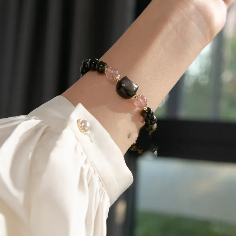 Black obsidian bracelet with 8mm stones and kitty charms on adjustable cord