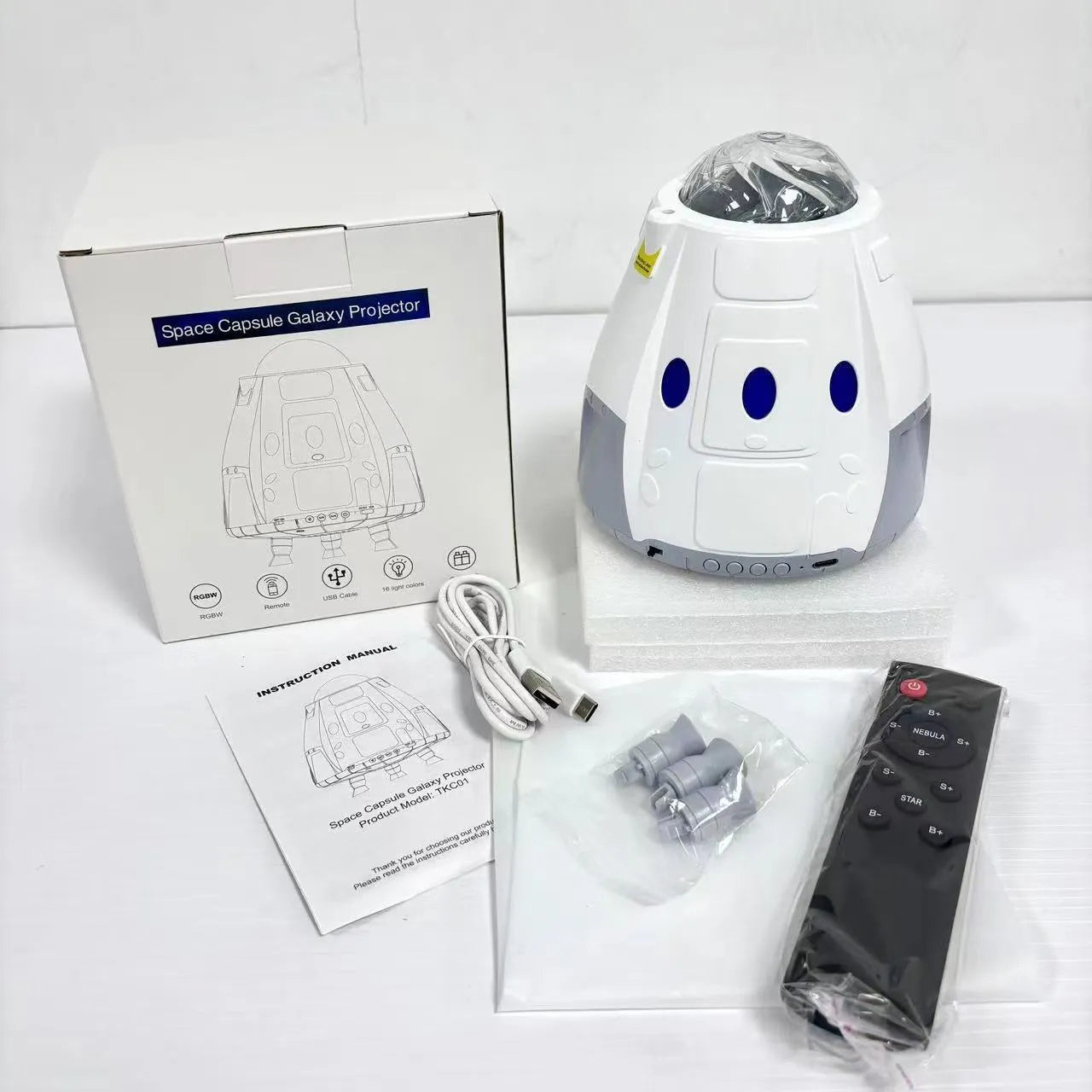 USB space capsule projector lamp showing starry galaxy projection effect with remote control