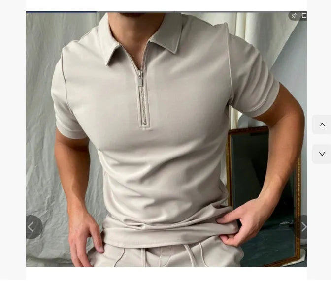 Man wearing a navy blue digital print polo shirt with short sleeves and a loose fit.