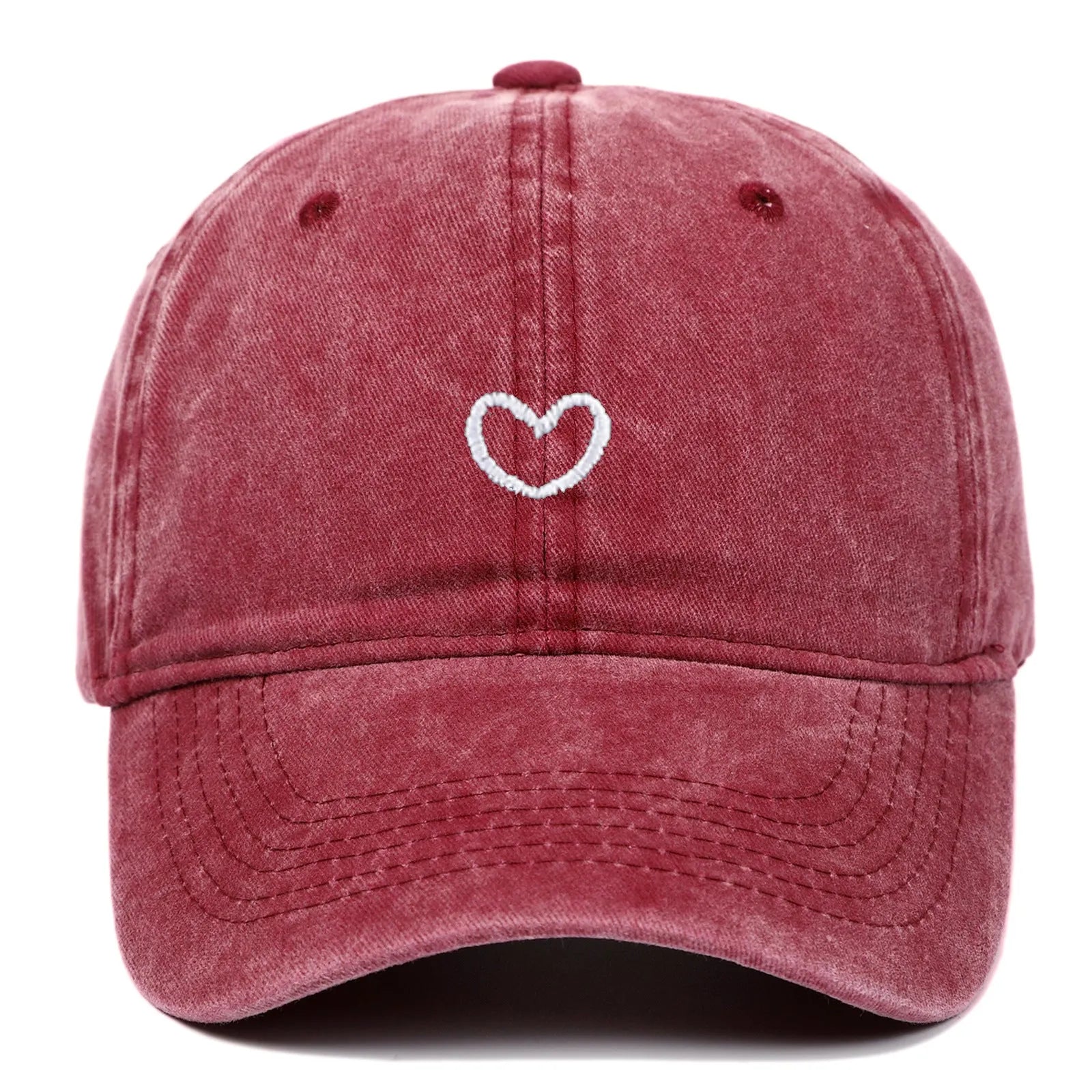 Adjustable cotton baseball cap featuring a distressed embroidered love heart on the front, shown in a selection of colours.