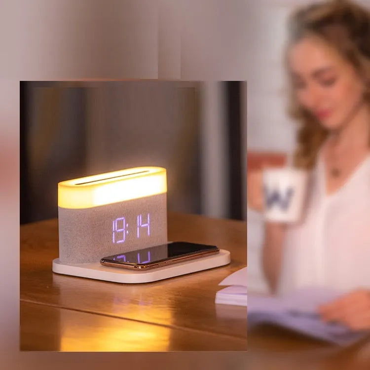 Black or white table lamp with wireless phone charging pad and digital clock display