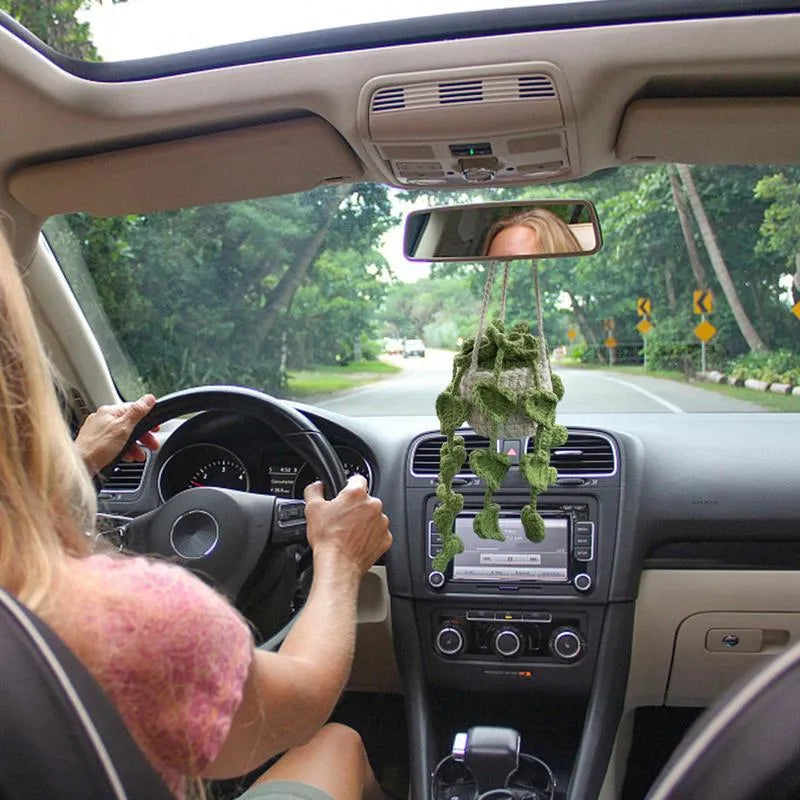 Green and white knitted wool car plant decoration with 8cm base and hanging rope.