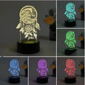Modern acrylic dream catcher night light on a table showing colourful light modes, with a remote control nearby.