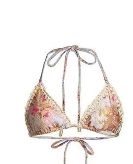 Creamy white floral print women's bikini set with attached skirt, showing top, briefs, and skirt components