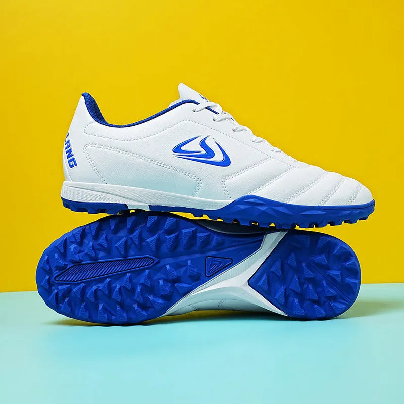 Low-top outdoor soccer shoes in a broken nail colour pattern with a rubber sole and lace-up front.