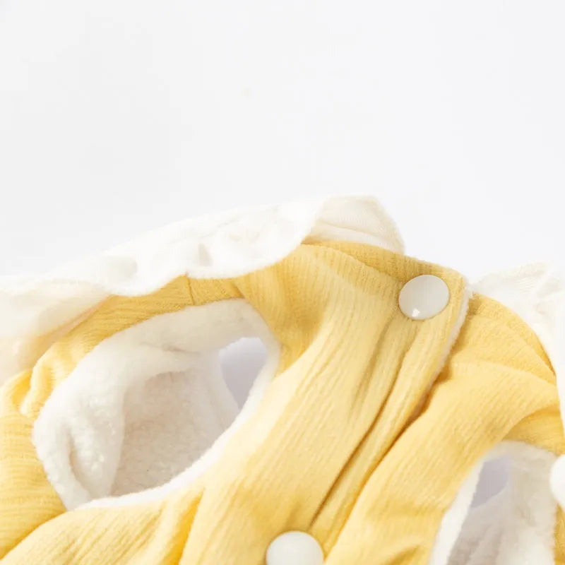 Bunny embroidered pet coat with ruffled white collar and fluffy pom-pom tail in lavender colour on a small dog