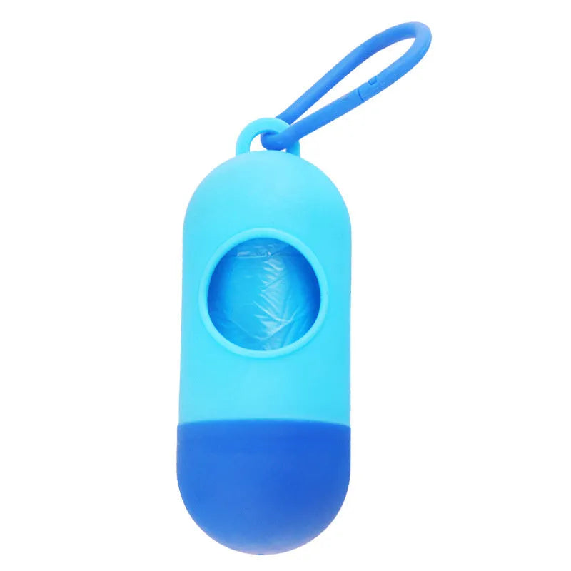 Compact black dog waste bag dispenser with a side hook and Velcro strap on its base.