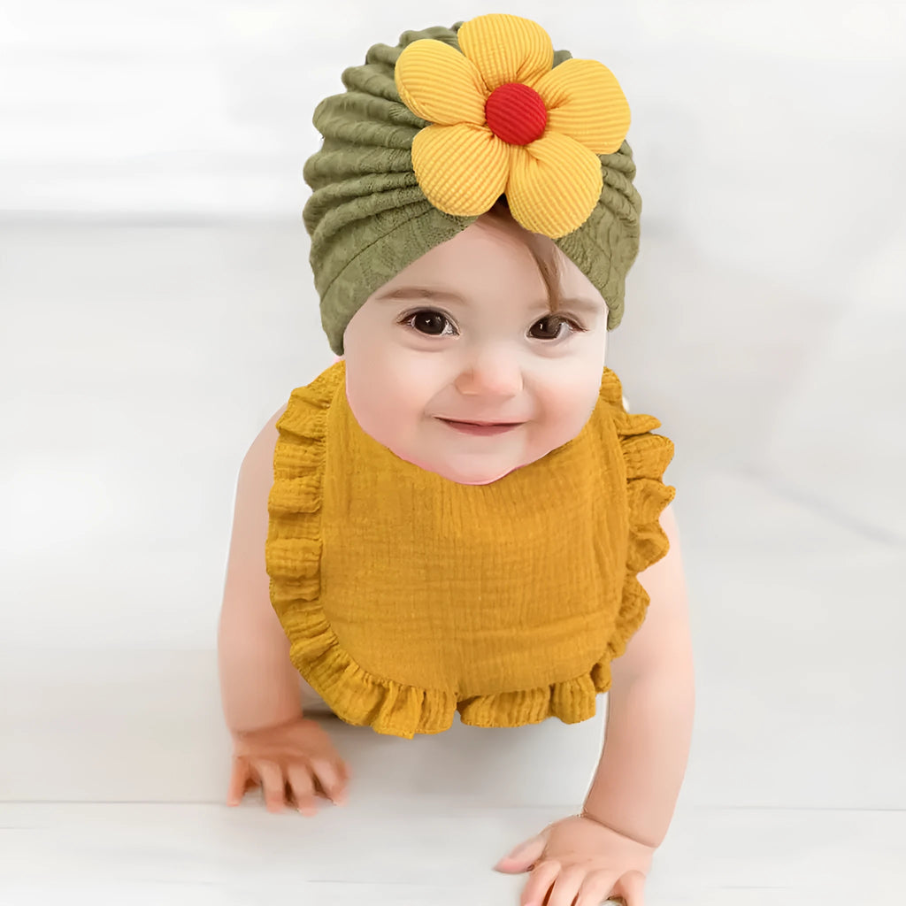 Newborn baby hat and bib set in organic cotton muslin with frilly lace trim