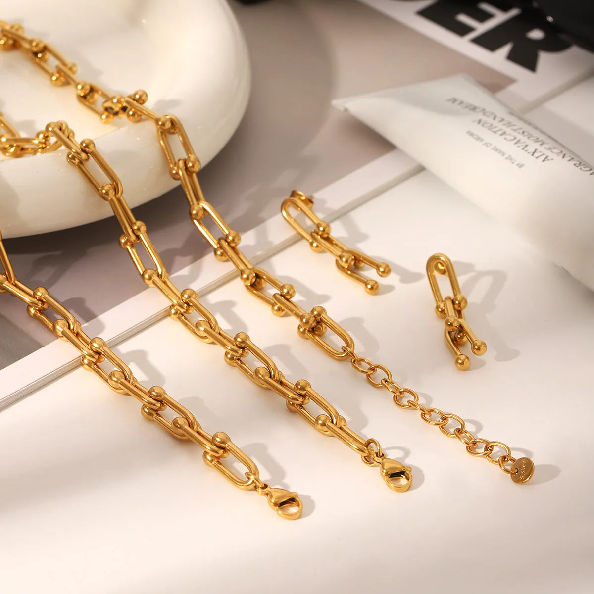 Stainless steel horseshoe chain jewellery set with titanium pendant in multiple colour options
