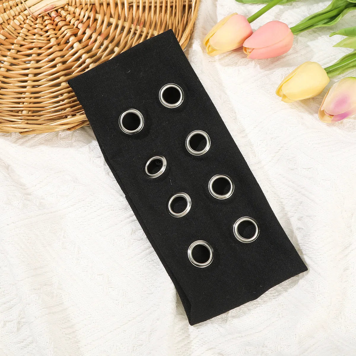 Hollow metal punk hair band with circle decoration in seven colour options on a white background.