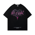 Man wearing a black loose-fit cotton T-shirt with a retro printed design on the front.