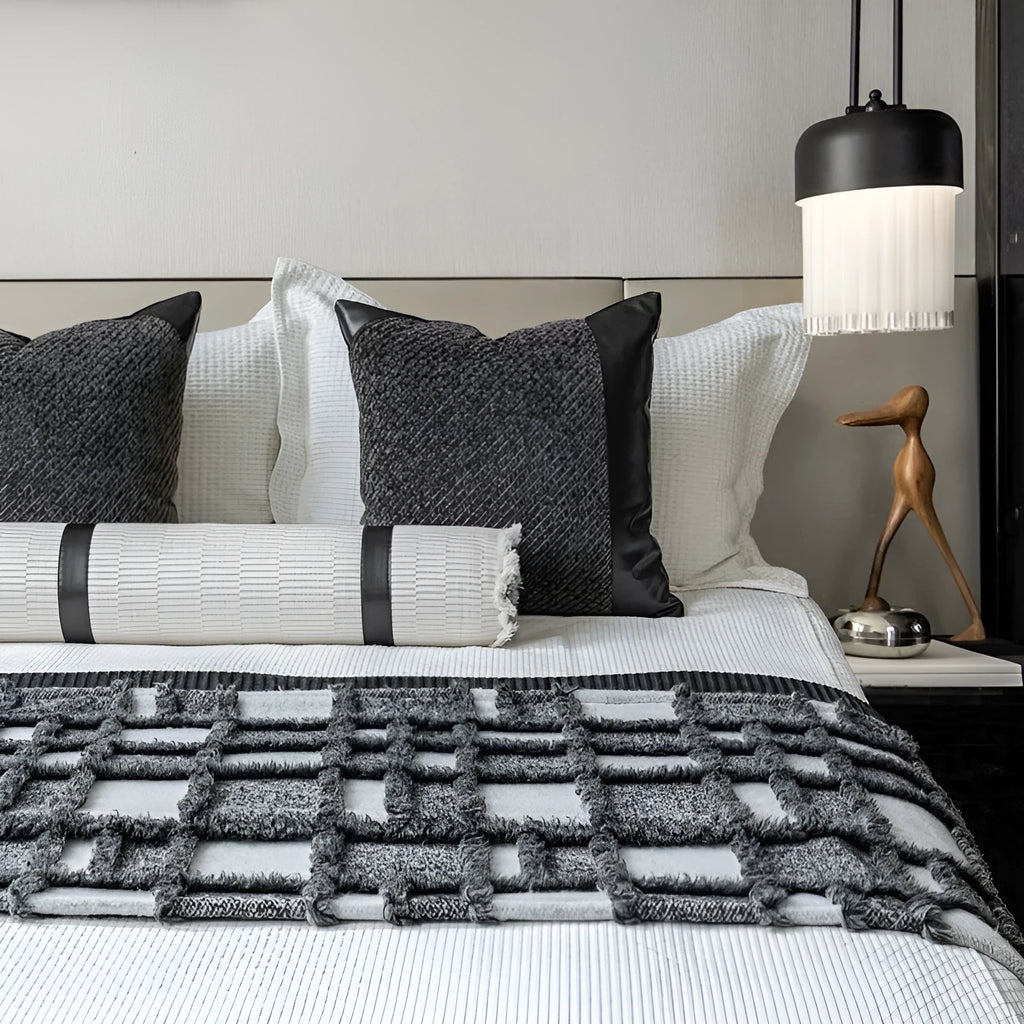 Modern minimalist grey and white plaid bed runner blanket set with pillow on a double bed.
