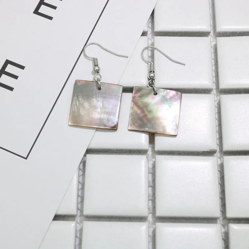 Geometric shell earrings with rectangular or square panther patterns, natural material, retro design