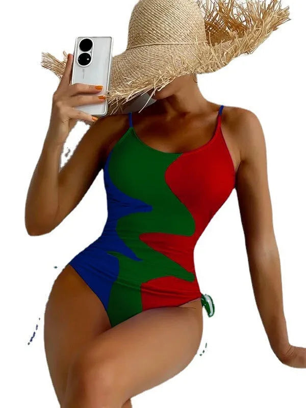 Women's sleeveless one-piece swimsuit in blue with striped pattern, backless design.