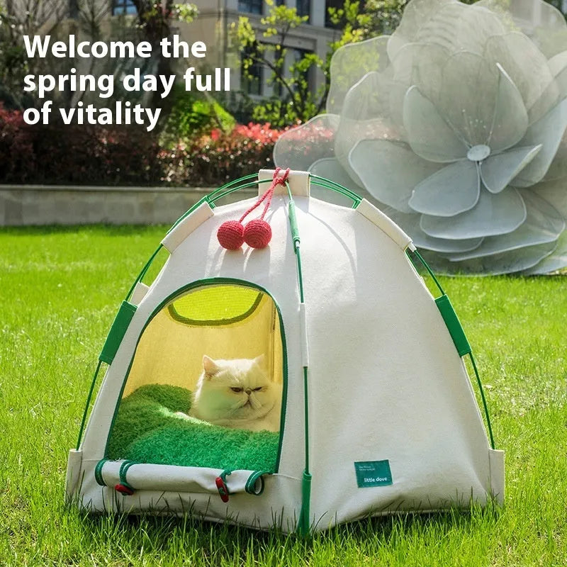 Beige dome-shaped cloth cat tent with a thick padded mat inside, shown on a wooden floor.