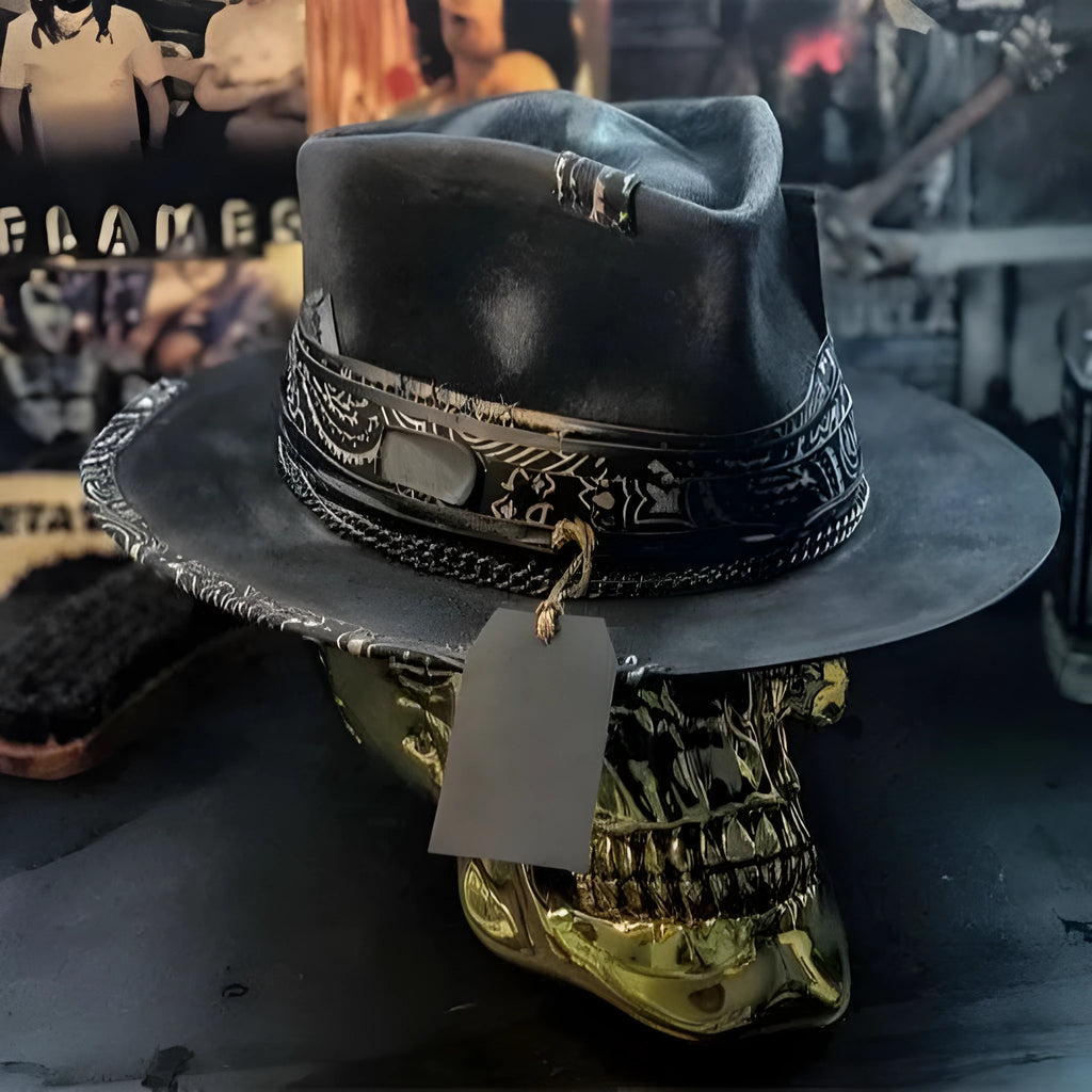 Handmade wool felt skull hat with a conical crown shape on a mannequin head.