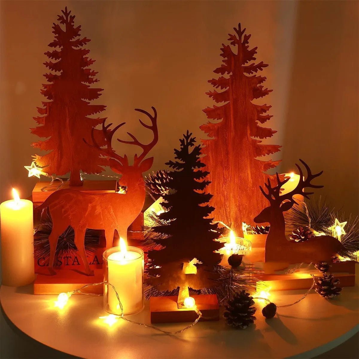 Three rustic iron metal Christmas tree decorations with elk silhouettes and weathered finish