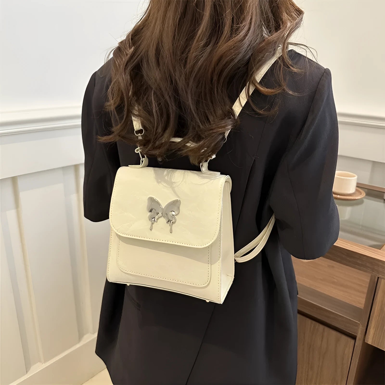Women's preppy style PU hand-carry backpack with bow detail in light blue colour