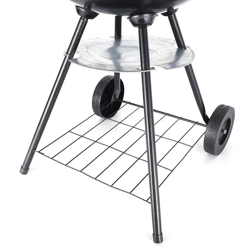 Portable 14-inch iron barbecue grill with Apple stove minimalist design on a patio.
