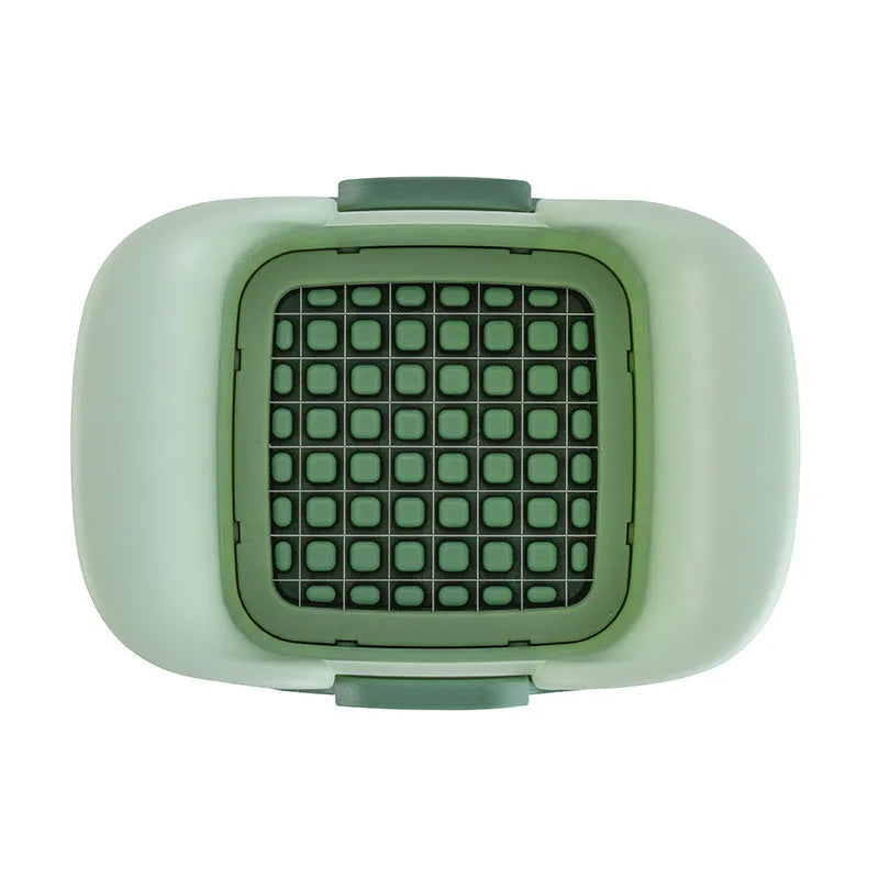 Green handheld multi-functional vegetable chopper with stainless steel blades for onions and potatoes