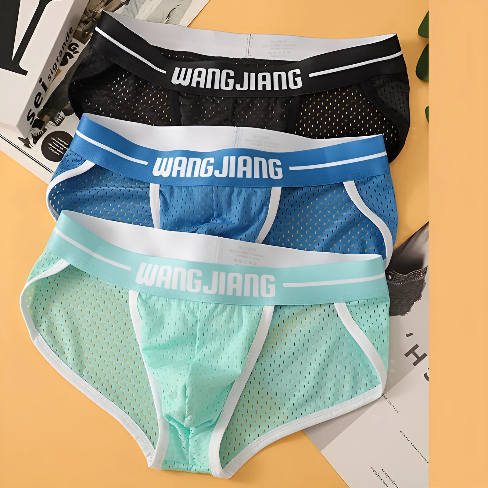 Men's solid colour ice silk triangle underwear briefs in breathable mesh fabric with quick-drying properties