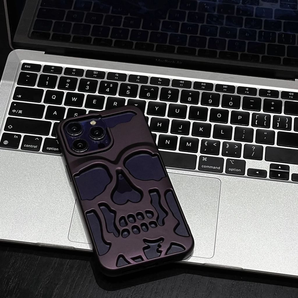 Frosted skull TPU phone case in matte black for iPhone 14 Pro showing hollow skull design