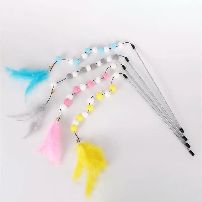 A blue acrylic cat teaser wand with pompon feathers and a bell, shown next to a grey and yellow version.