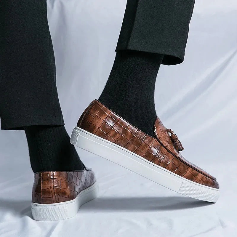 Men's black synthetic leather sneakers with tassle detail and oversleeve design.