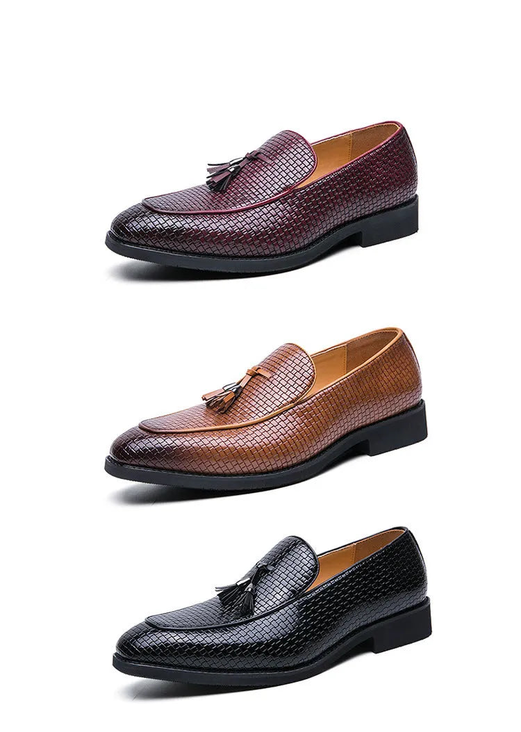 Men's black pointed slip-on business shoes with a tassel detail on the artificial PU leather upper.