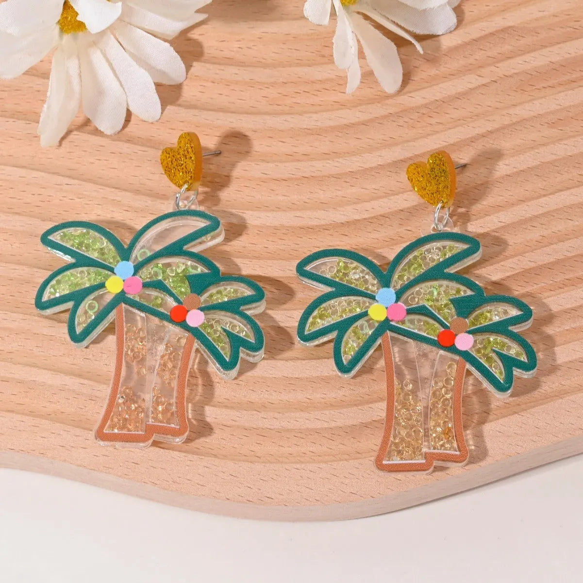 Colourful acrylic earrings with realistic fruit and dessert charms including cherry, strawberry, and ice cream.