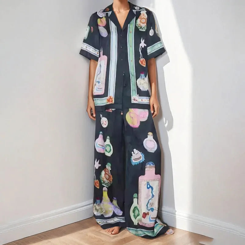 Black women's cardigan and trouser set with cartoon animation print