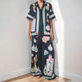 Black women's cardigan and trouser set with cartoon animation print