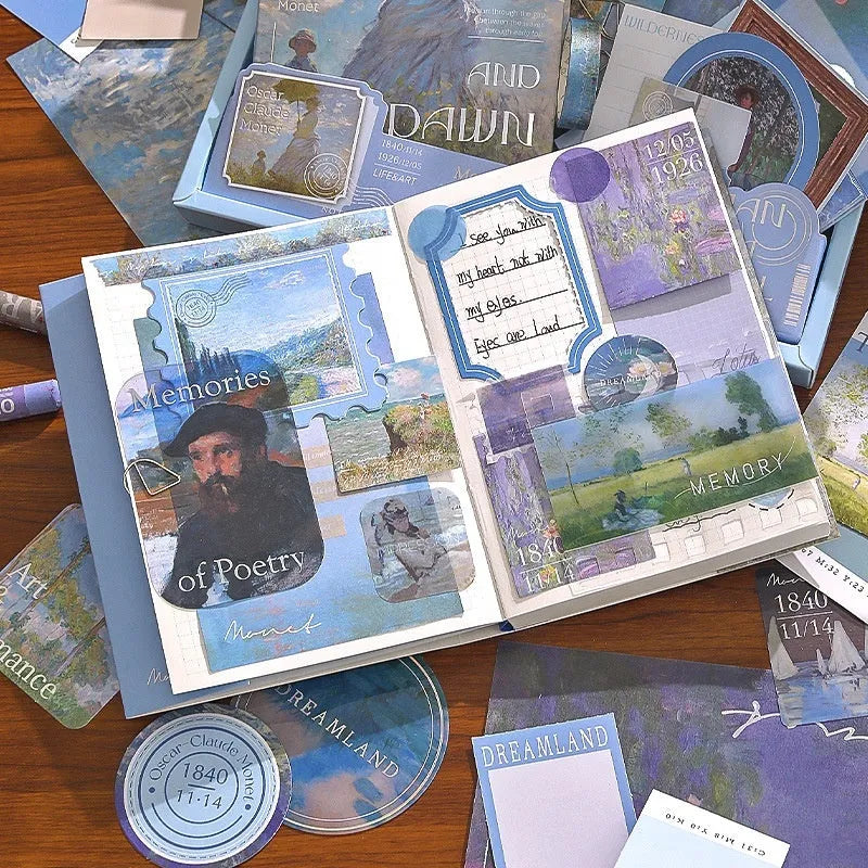 A6 creative journal gift box open to show grid notebook, bookclothes cover, material paper, cards, envelopes, stickers, and a water drop bookmark.