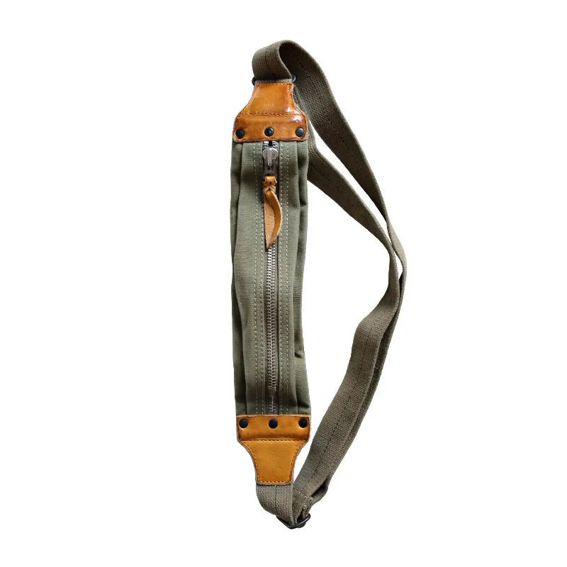 Green American retro military-style chest bag made of washed canvas with Italian leather accents