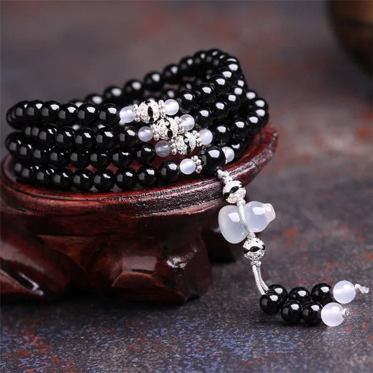 Black agate 108 bead unisex geometric bracelet with number elements.