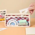 Transparent PVC pencil case with chessboard grid pattern in black and white or red and white.