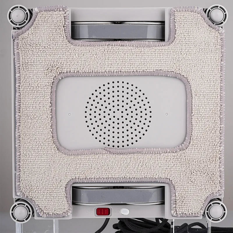White intelligent window cleaning robot with water spray nozzles for high-rise windows