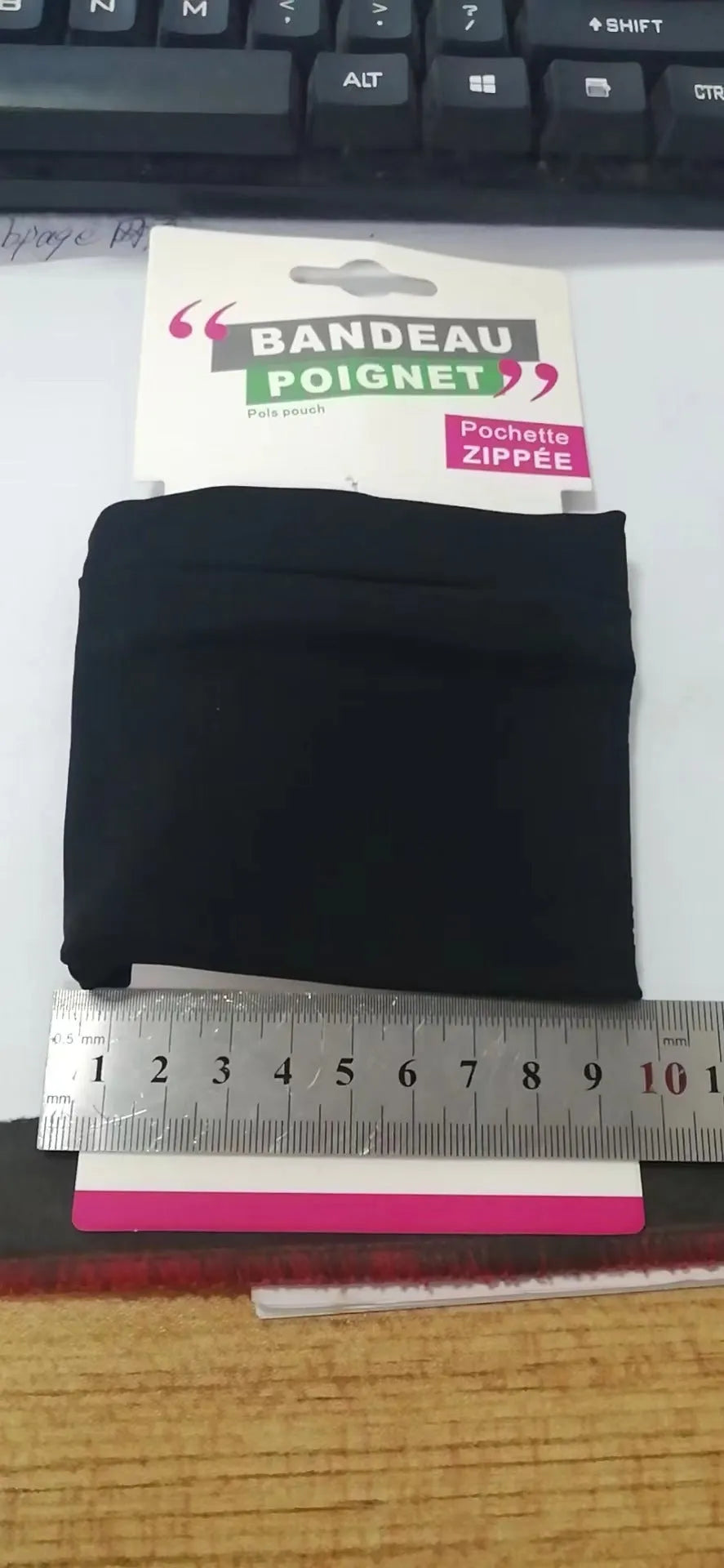 Adjustable wrist armband with a phone compartment, shown for camping and fitness use.