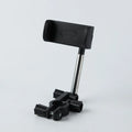 Black ABS car rearview mirror phone holder with 360-degree rotation mounted on a car mirror